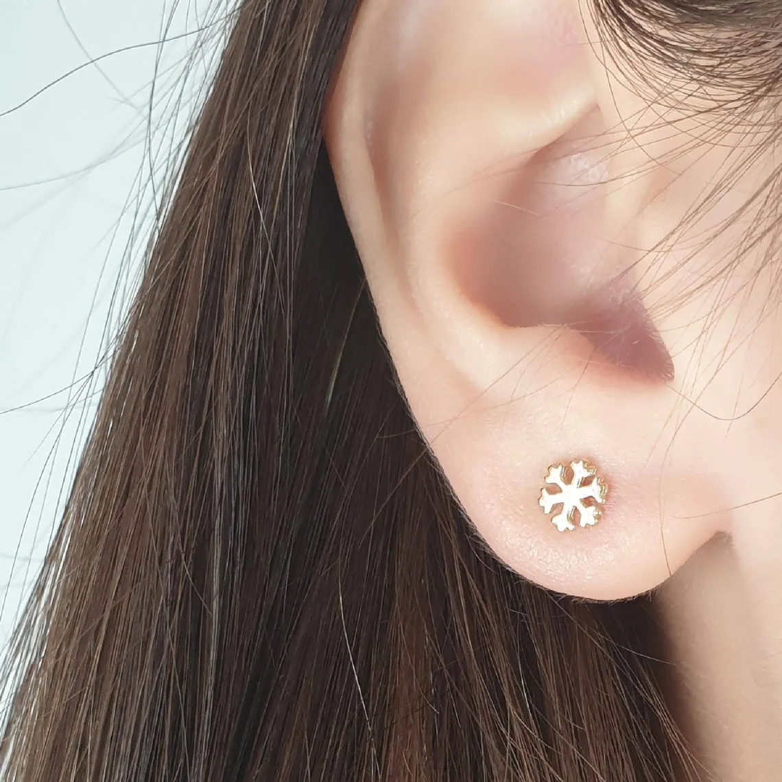 Snowflake On A Gold Earring