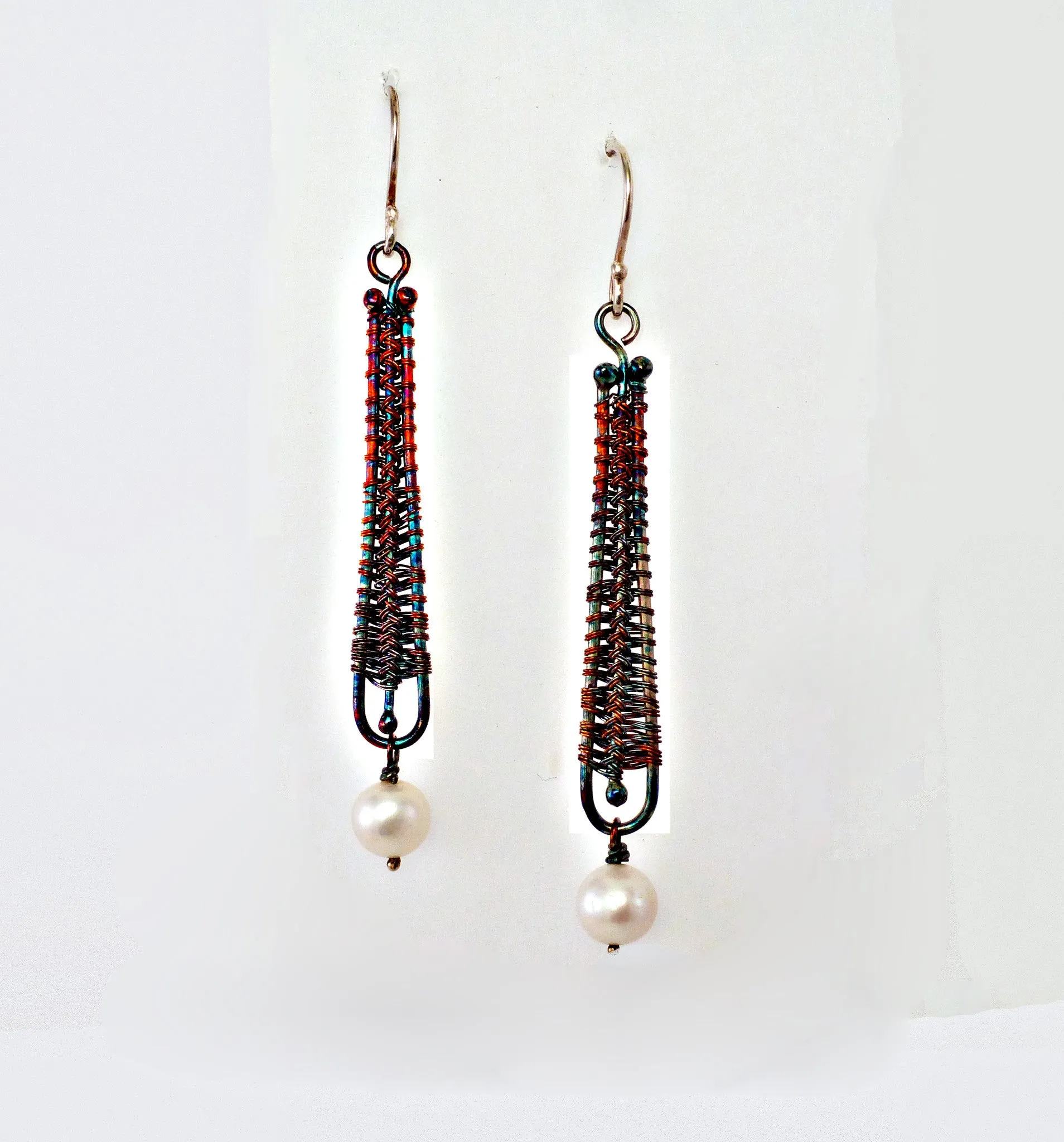 Woven silver earrings with pearl drop